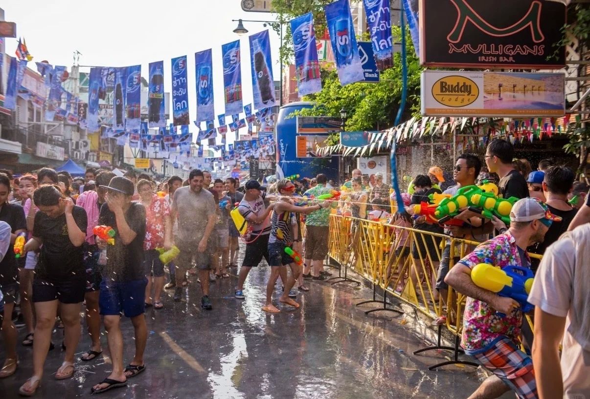 Silom, or Khao San Road, in Bangkok during Songkran. The street is packed. Do not book a quiet hotel on this block.